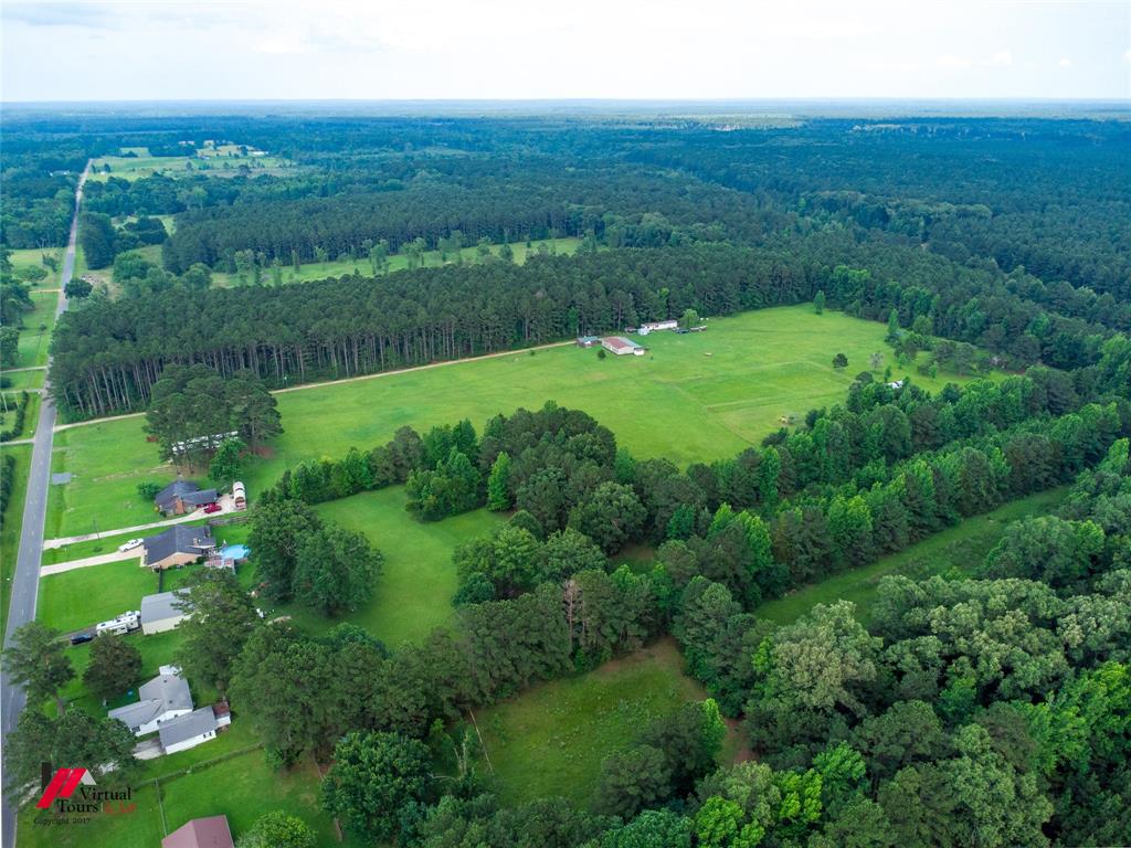 555 Thomasville Road Sarepta, LA 71071 - Photo 37 of 40 a view of a green field with an ocean view
