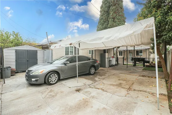 a front view of a house with parking space