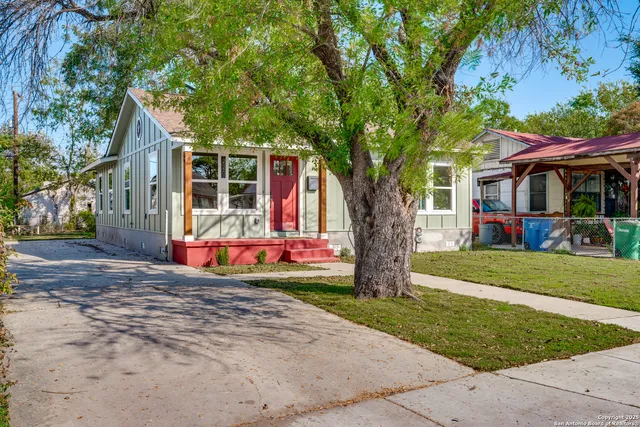 a view of a trees in front of a house