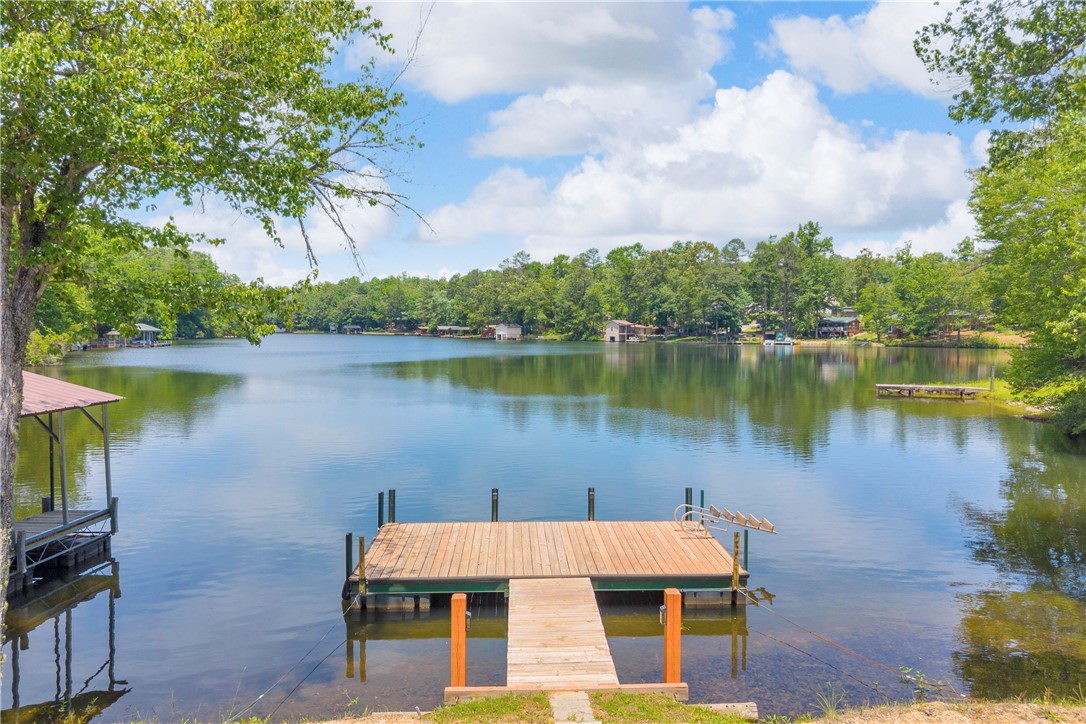 334 Lake Becky Road Mountain Rest, SC 29664 - Photo 35 of 46 A tranquil lake view awaits, complete with a private dock and mature trees.