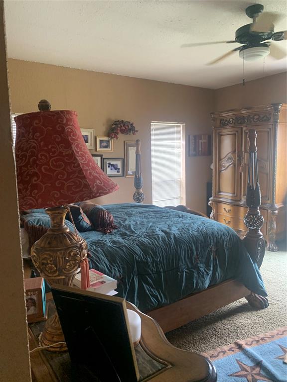 1980 Compass Way Bluff Dale, TX 76433 - Photo 11 of 16 a bedroom with a bed and window
