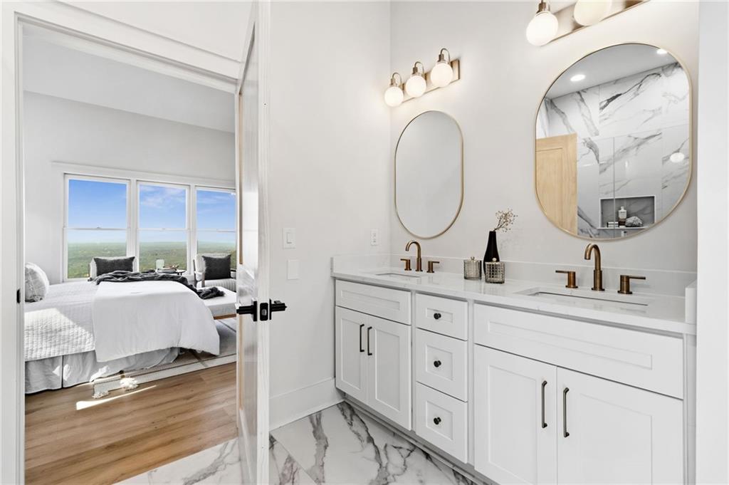 5388 Monument Road Jasper, GA 30143 - Photo 17 of 45 a en suite bathroom with double sink and a mirror