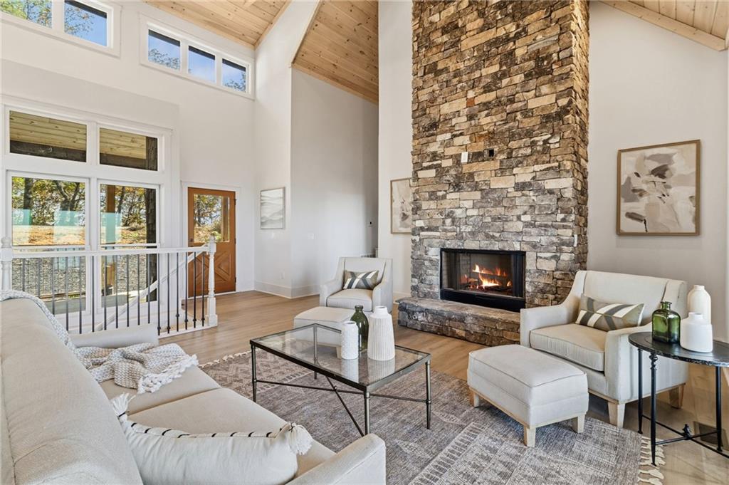 5388 Monument Road Jasper, GA 30143 - Photo 6 of 45 a living room with furniture a table and a fireplace