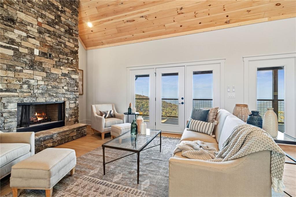 5388 Monument Road Jasper, GA 30143 - Photo 7 of 45 a living room with furniture and a fireplace