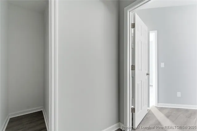 a view of a bedroom from a hallway
