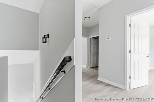 a view of a hallway view with staircase