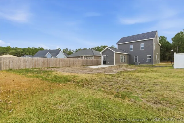 a swimming pool with trees in the background