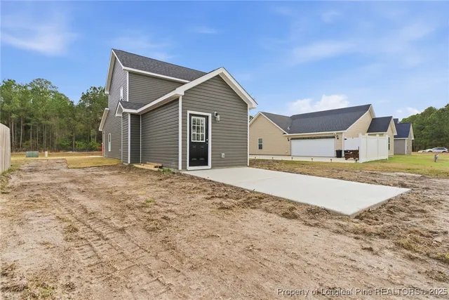 a house with trees in the background