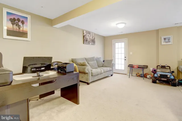 a view of a livingroom with furniture and a flat screen tv