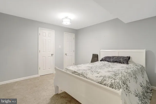 a bedroom with a bed and a table in it
