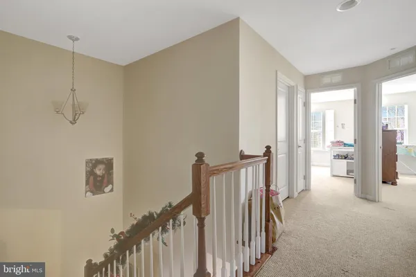 a bedroom with a bed and a dresser next to a window