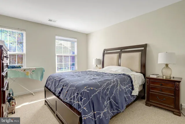 a bedroom with a bed and a television