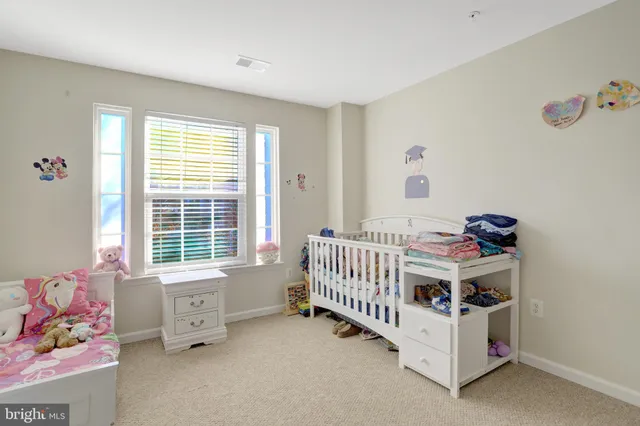 a bathroom with a sink toilet vanity and shower