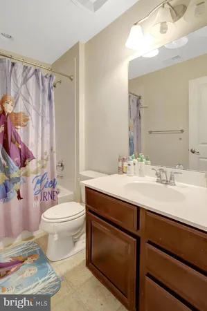a bedroom with a bed and a dresser in it