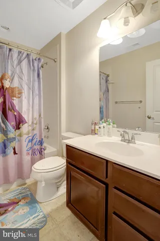 a bedroom with a bed and a dresser in it