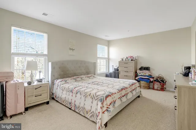 a bath tub sitting next to a shower
