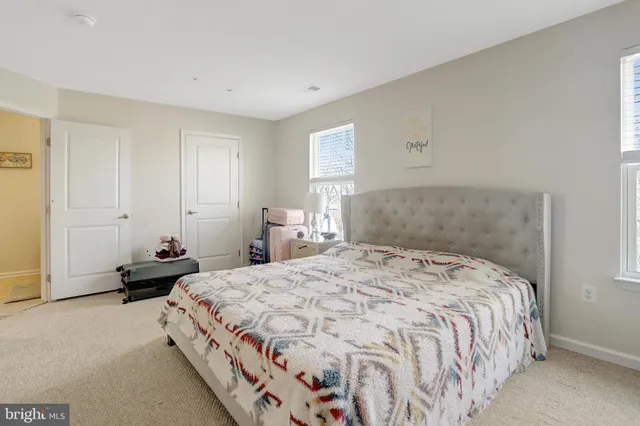 a white bath tub sitting next to a white toilet