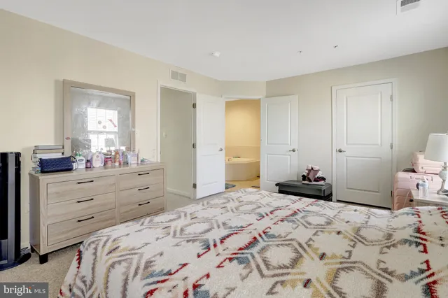 a bathroom with a sink vanity and mirror