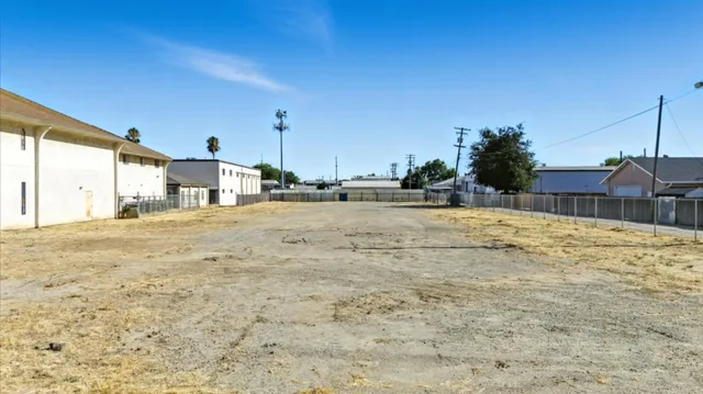 a swimming pool with an outdoor space and seating area