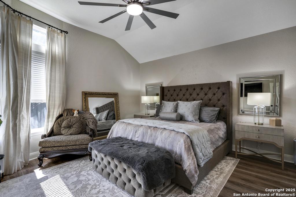 13326 Windmill Trace Helotes, TX 78023 - Photo 16 of 34 a bedroom with a bed and a couch