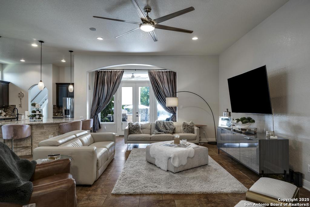 13326 Windmill Trace Helotes, TX 78023 - Photo 4 of 34 a living room with furniture and a flat screen tv