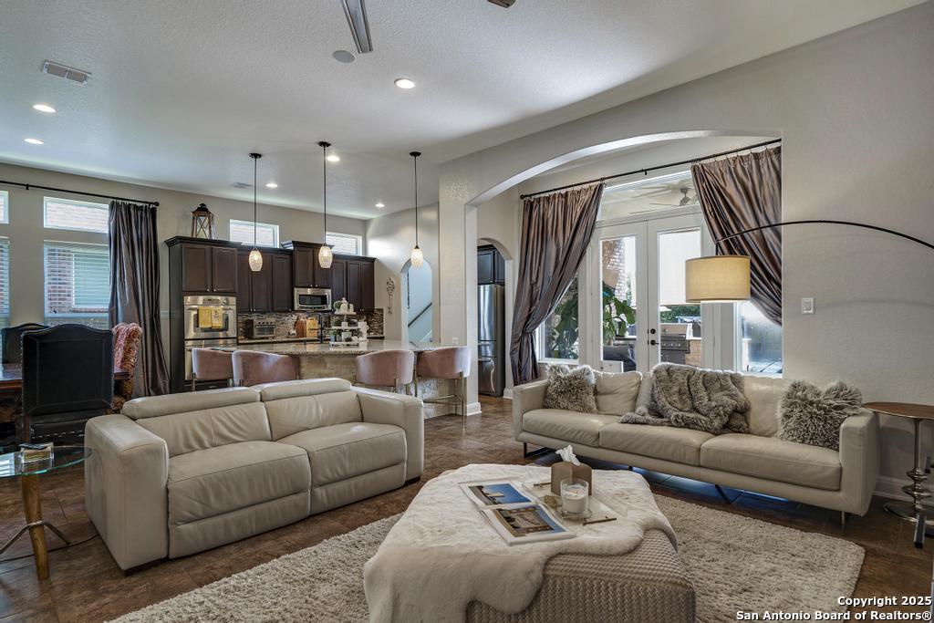 13326 Windmill Trace Helotes, TX 78023 - Photo 8 of 34 a living room with furniture and a large window