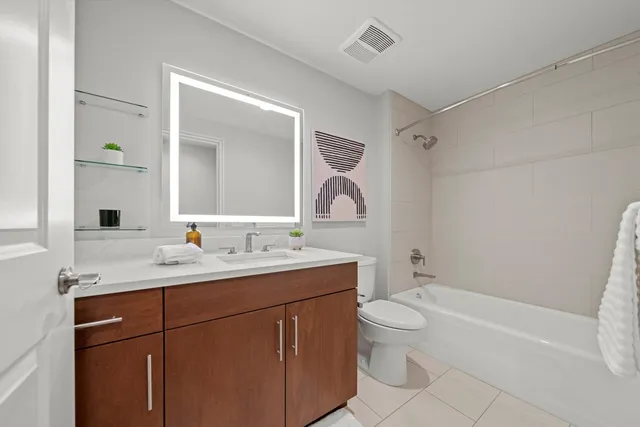 a kitchen with a sink cabinets and window