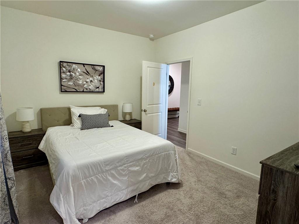 152 Andria Way Northwest Cartersville, GA 30120 - Photo 12 of 24 a bedroom with a bed and painting on the wall