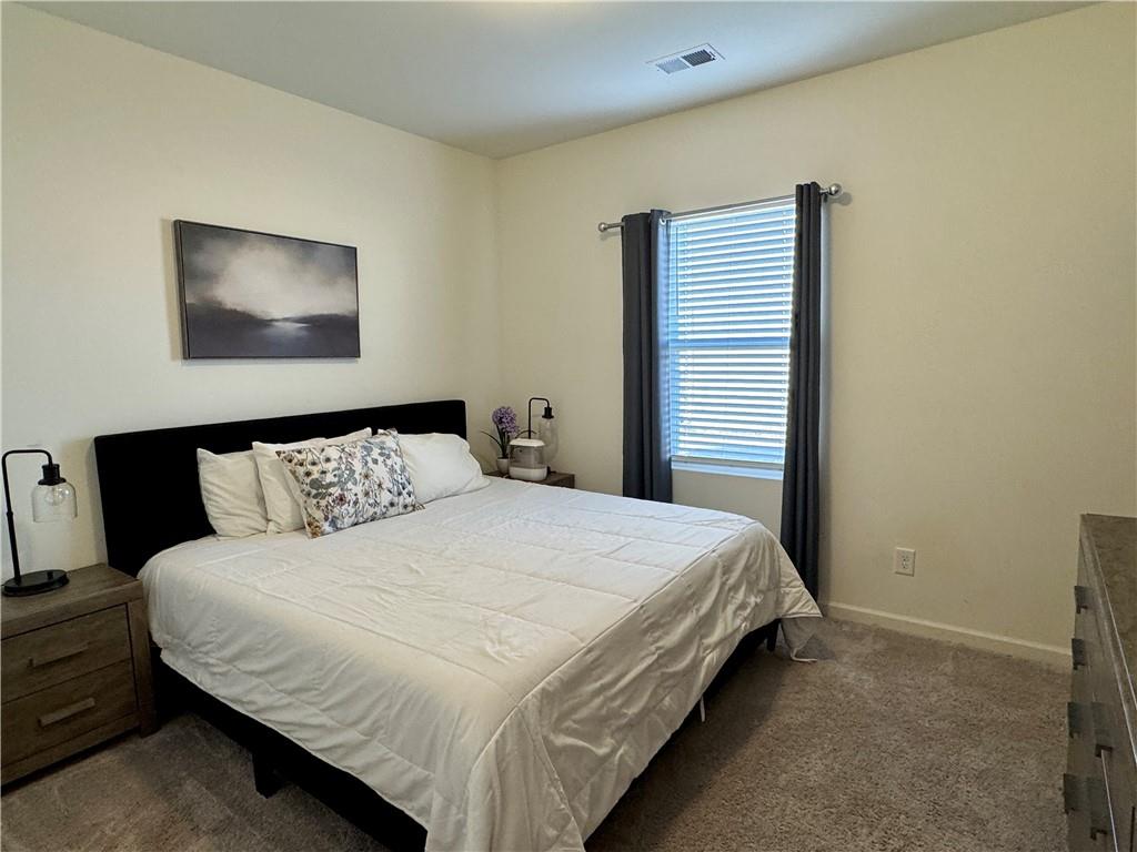 152 Andria Way Northwest Cartersville, GA 30120 - Photo 16 of 24 a bedroom with a bed and a painting on the wall