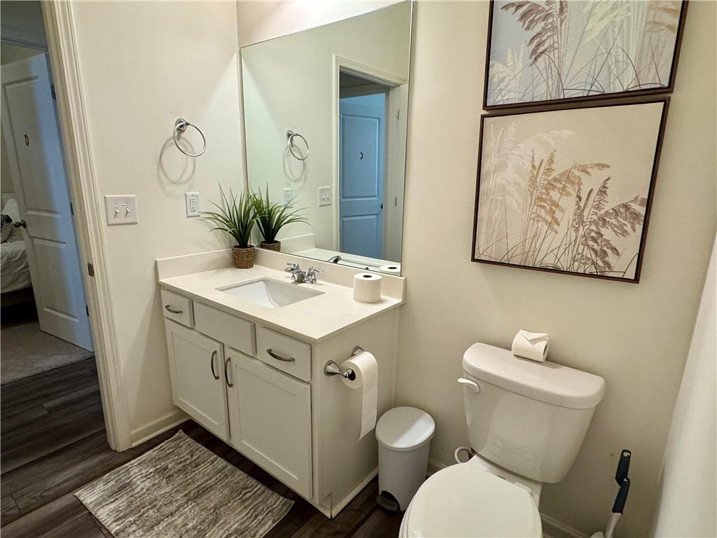 152 Andria Way Northwest Cartersville, GA 30120 - Photo 17 of 24 a bathroom with a toilet sink and mirror