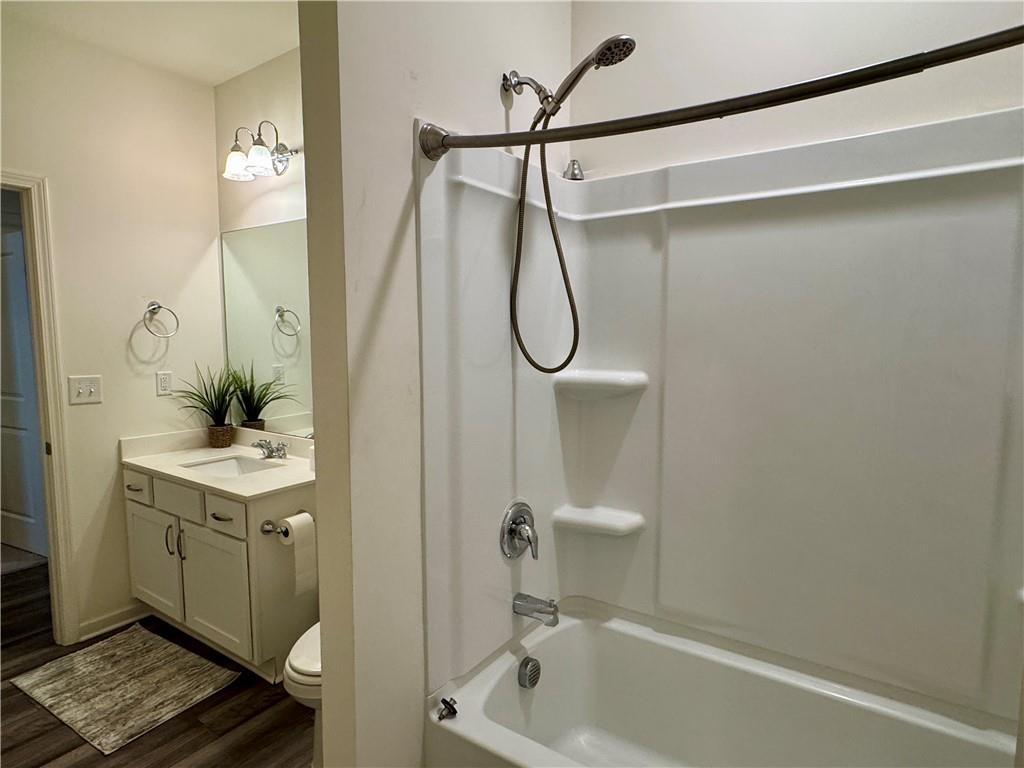 152 Andria Way Northwest Cartersville, GA 30120 - Photo 18 of 24 a bathroom with a shower a sink and a mirror