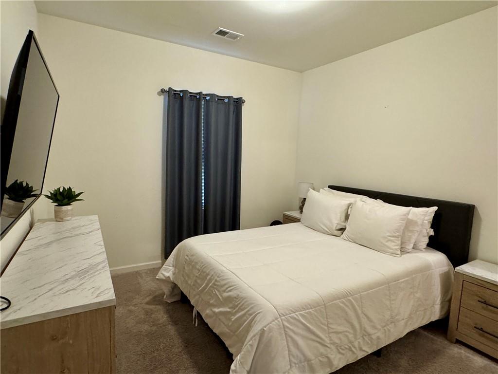 152 Andria Way Northwest Cartersville, GA 30120 - Photo 19 of 24 a bedroom with a bed and a mirror