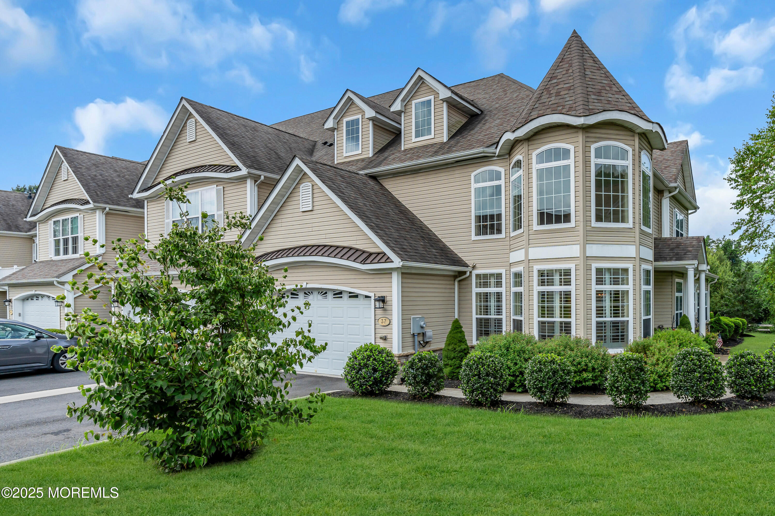 a front view of a house with a yard