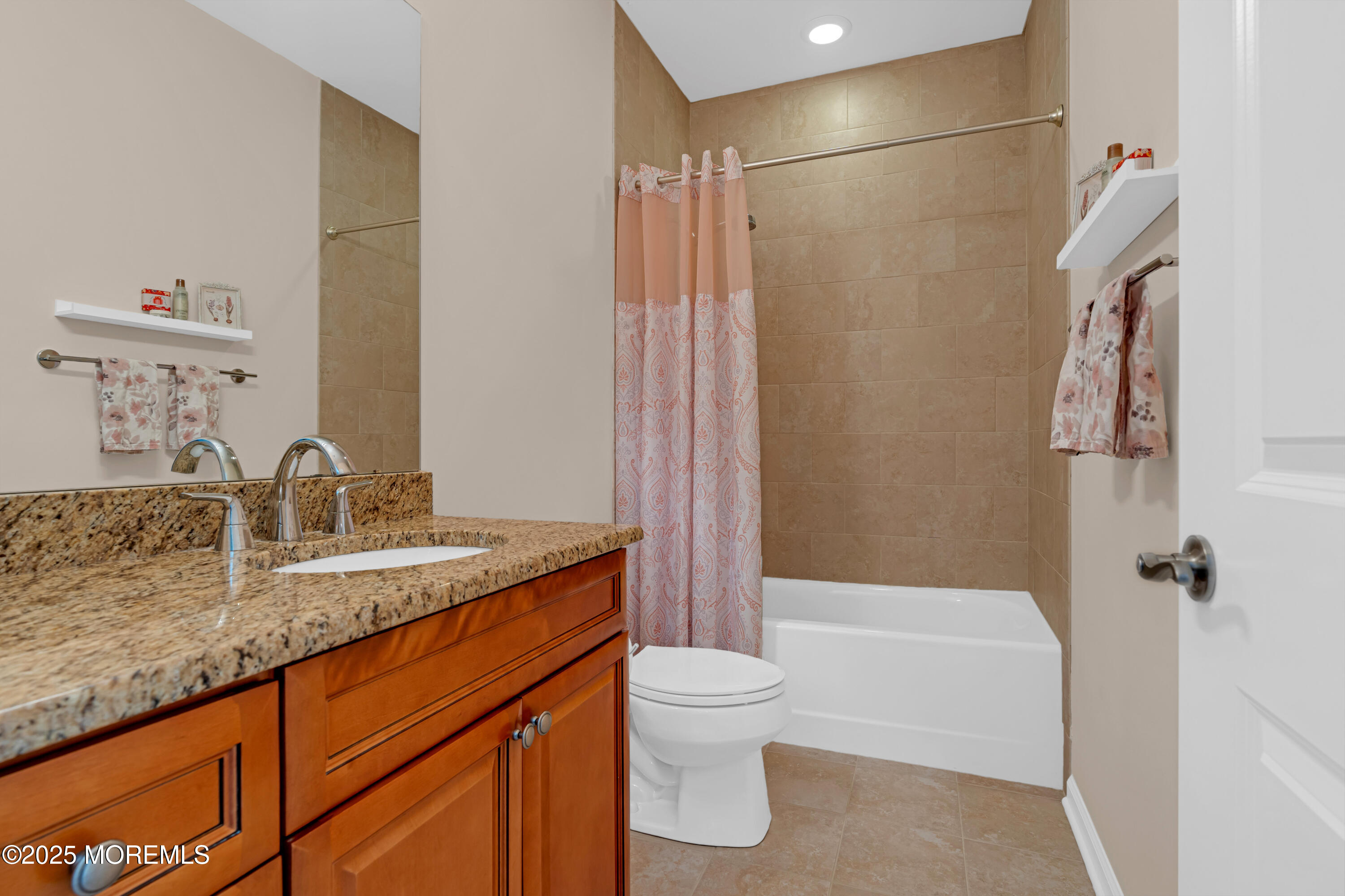 37 Abbey Road Tinton Falls, NJ 07753 - Photo 15 of 18 a bathroom with a granite countertop sink a toilet and shower
