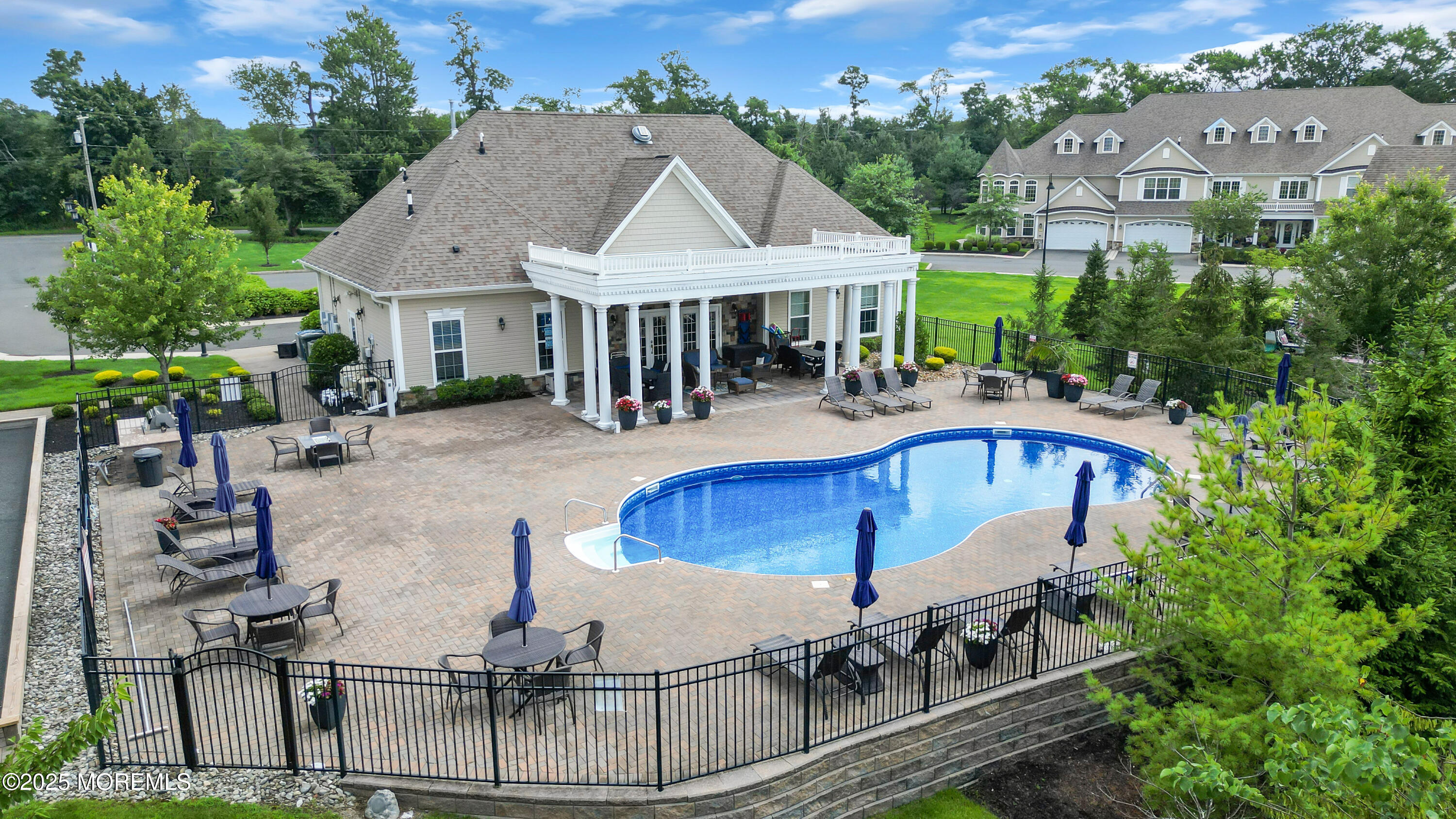 37 Abbey Road Tinton Falls, NJ 07753 - Photo 18 of 18 an aerial view of a house with swimming pool and outdoor seating