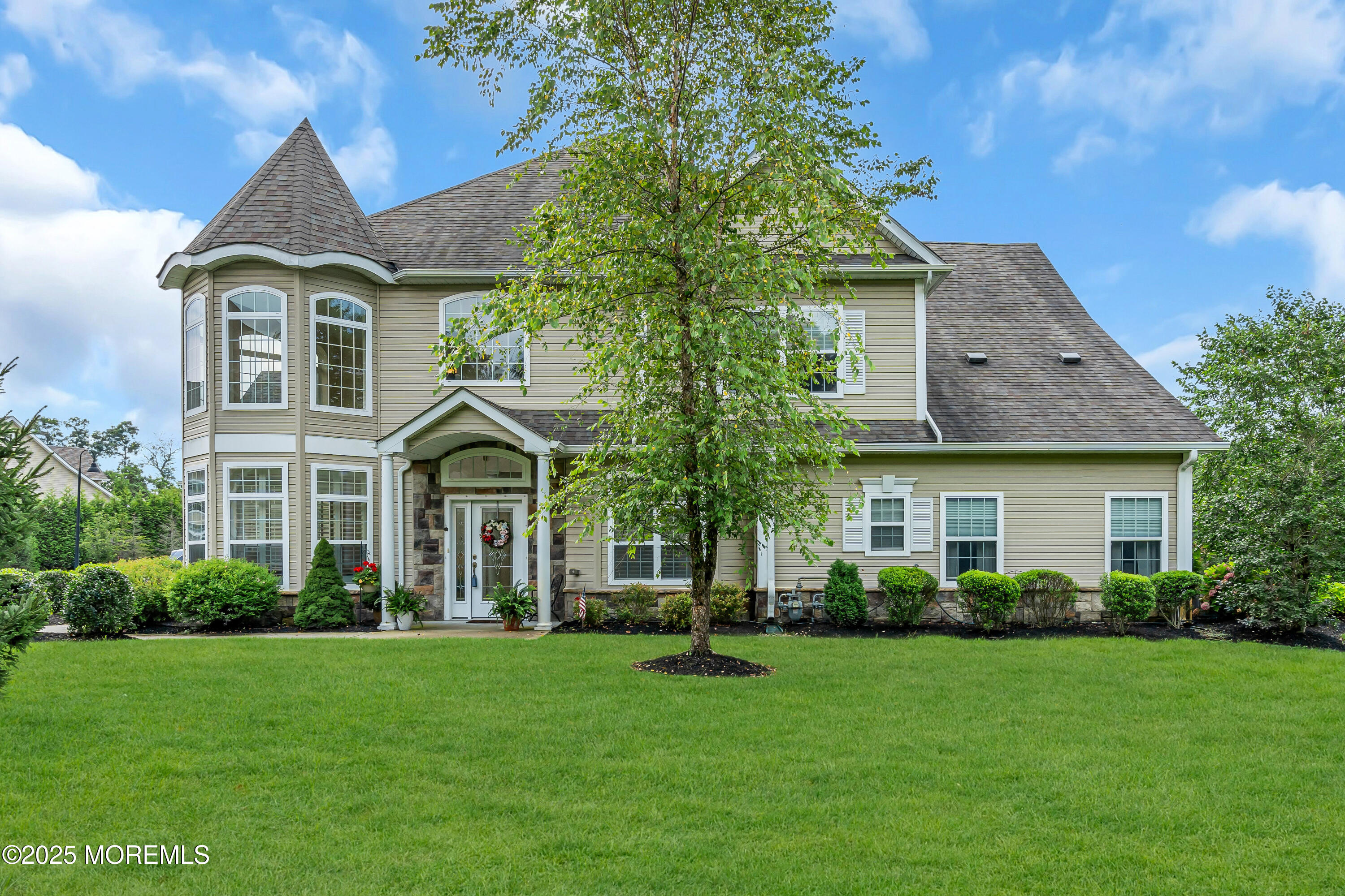 37 Abbey Road Tinton Falls, NJ 07753 - Photo 2 of 18 a front view of a house with a garden