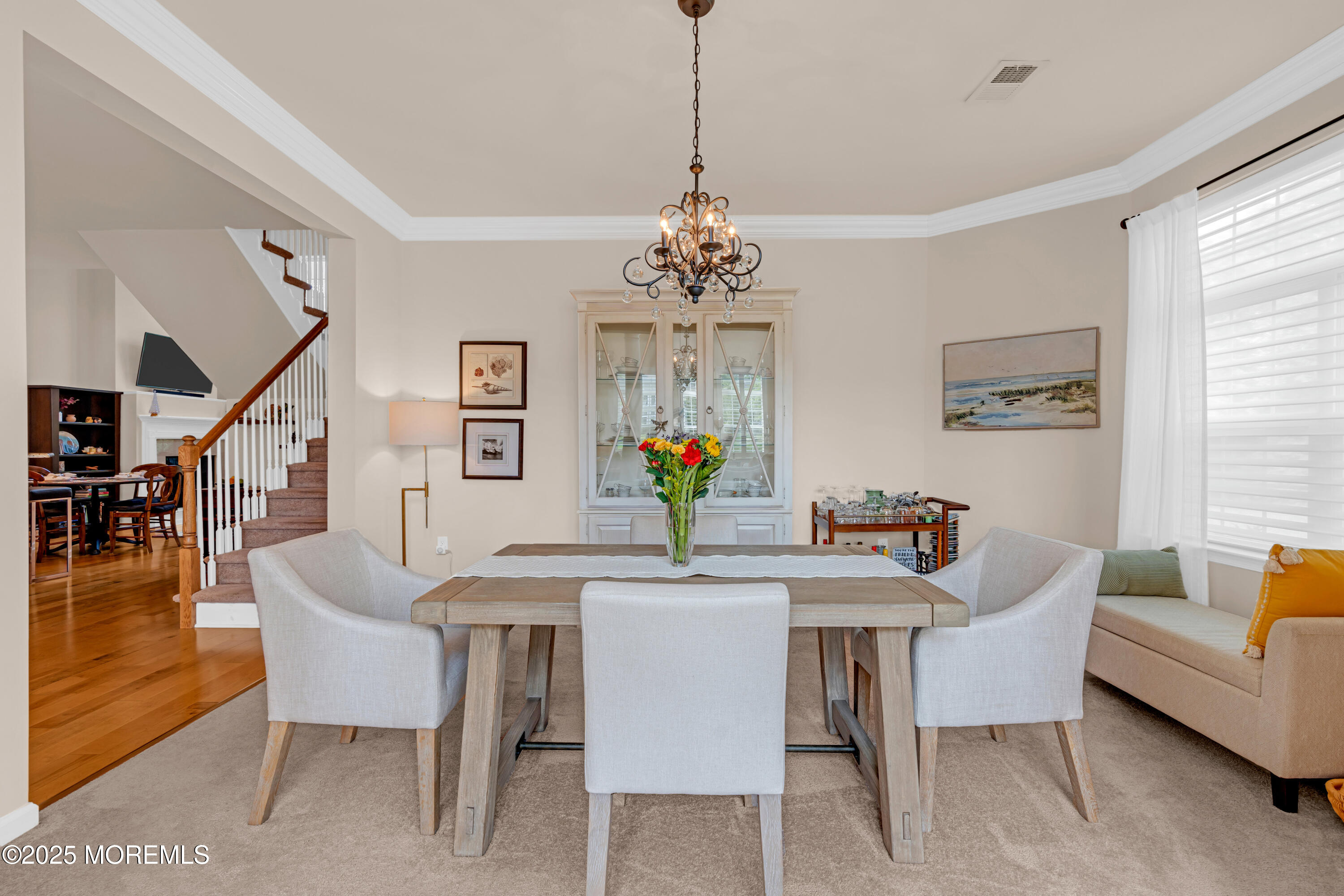 37 Abbey Road Tinton Falls, NJ 07753 - Photo 8 of 18 a dining room with furniture potted plants and wooden floor