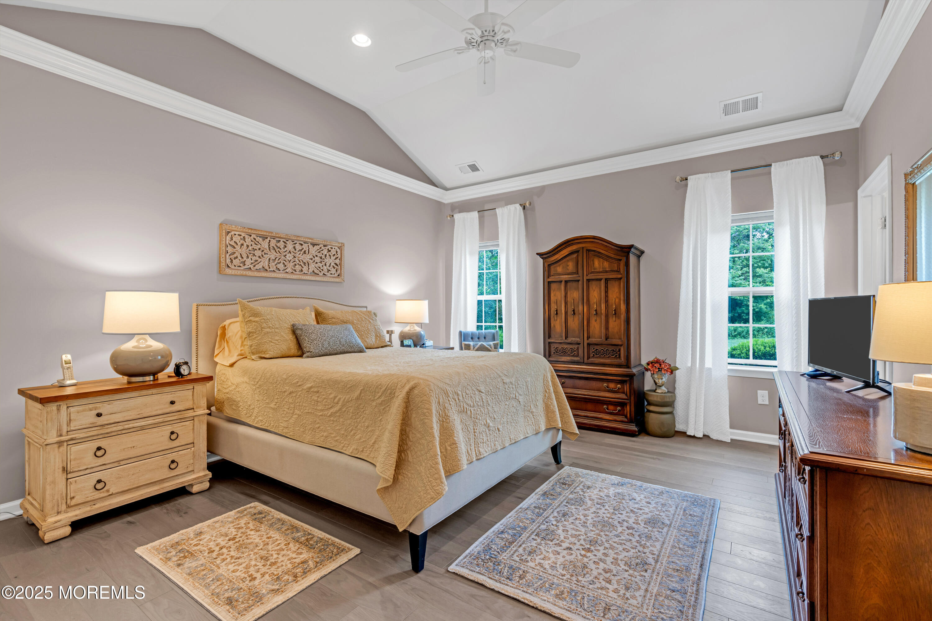 37 Abbey Road Tinton Falls, NJ 07753 - Photo 9 of 18 a bedroom with a bed and a flat tv screen on the dresser