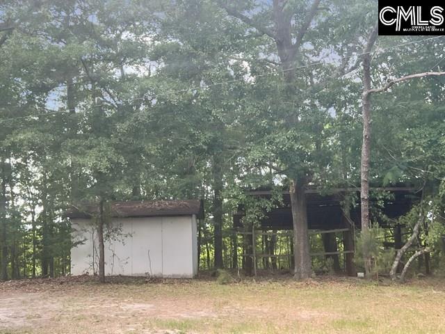5545 Pisgah Road Rembert, SC 29128 - Photo 6 of 26 a house view with a backyard