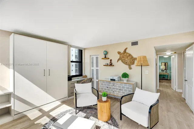 a living room with furniture and window