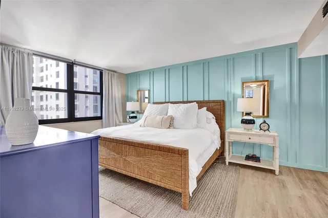 a bed room with a bed and a window