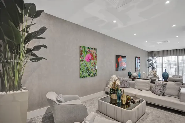 a living room with furniture or couch and a potted plant