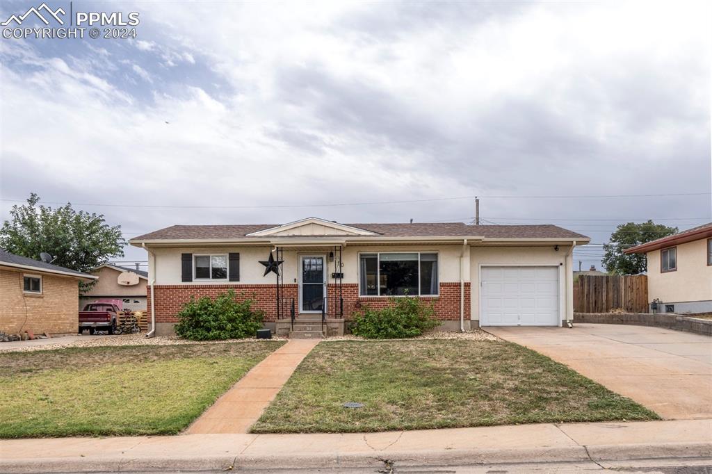50 Duke Street Pueblo, CO 81005 - Photo 1 of 45 a front view of a house with garden
