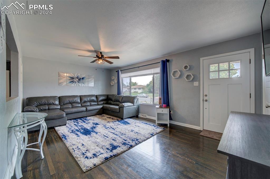 50 Duke Street Pueblo, CO 81005 - Photo 13 of 45 a living room with furniture and wooden floor