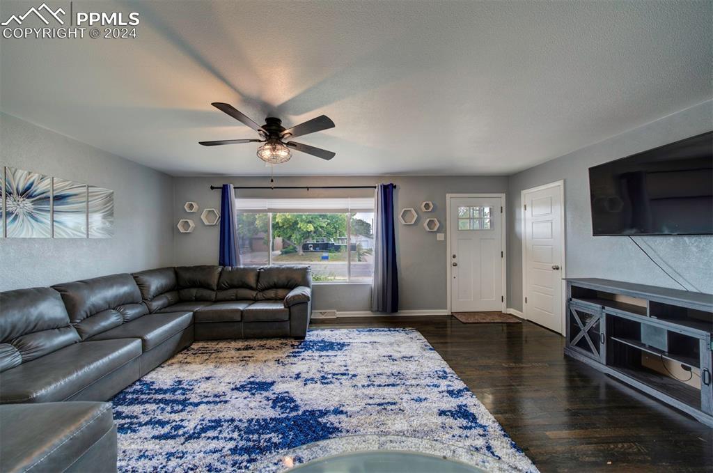 50 Duke Street Pueblo, CO 81005 - Photo 21 of 45 a living room with furniture and a flat screen tv
