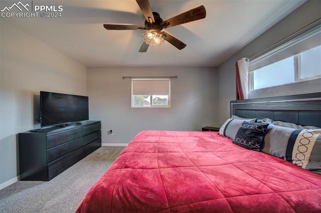 50 Duke Street Pueblo, CO 81005 - Photo 27 of 45 a bedroom with a bed and a flat screen tv