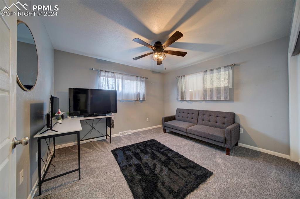 50 Duke Street Pueblo, CO 81005 - Photo 28 of 45 a living room with furniture and a flat screen tv