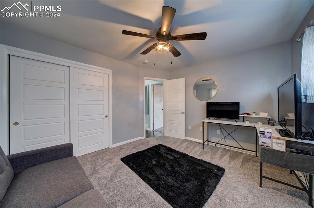 50 Duke Street Pueblo, CO 81005 - Photo 29 of 45 a living room with furniture and a flat screen tv