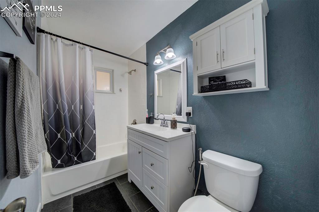 50 Duke Street Pueblo, CO 81005 - Photo 31 of 45 a bathroom with a toilet sink and mirror