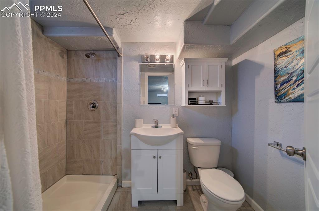 50 Duke Street Pueblo, CO 81005 - Photo 33 of 45 a bathroom with a sink toilet and shower